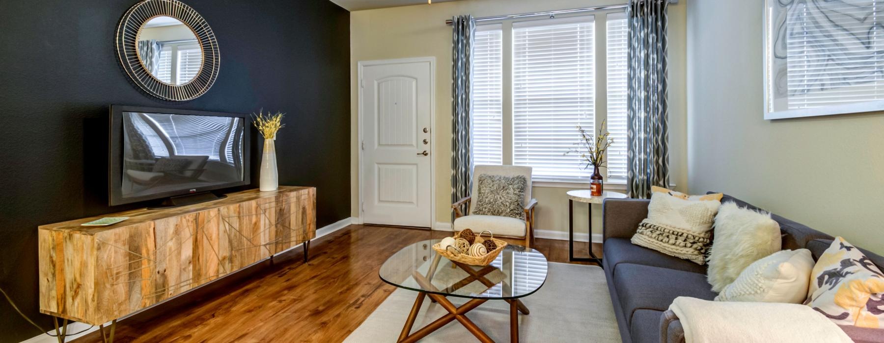a living room with a tv and couches