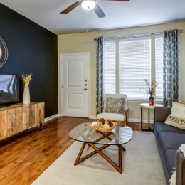 a living room with a tv and couches