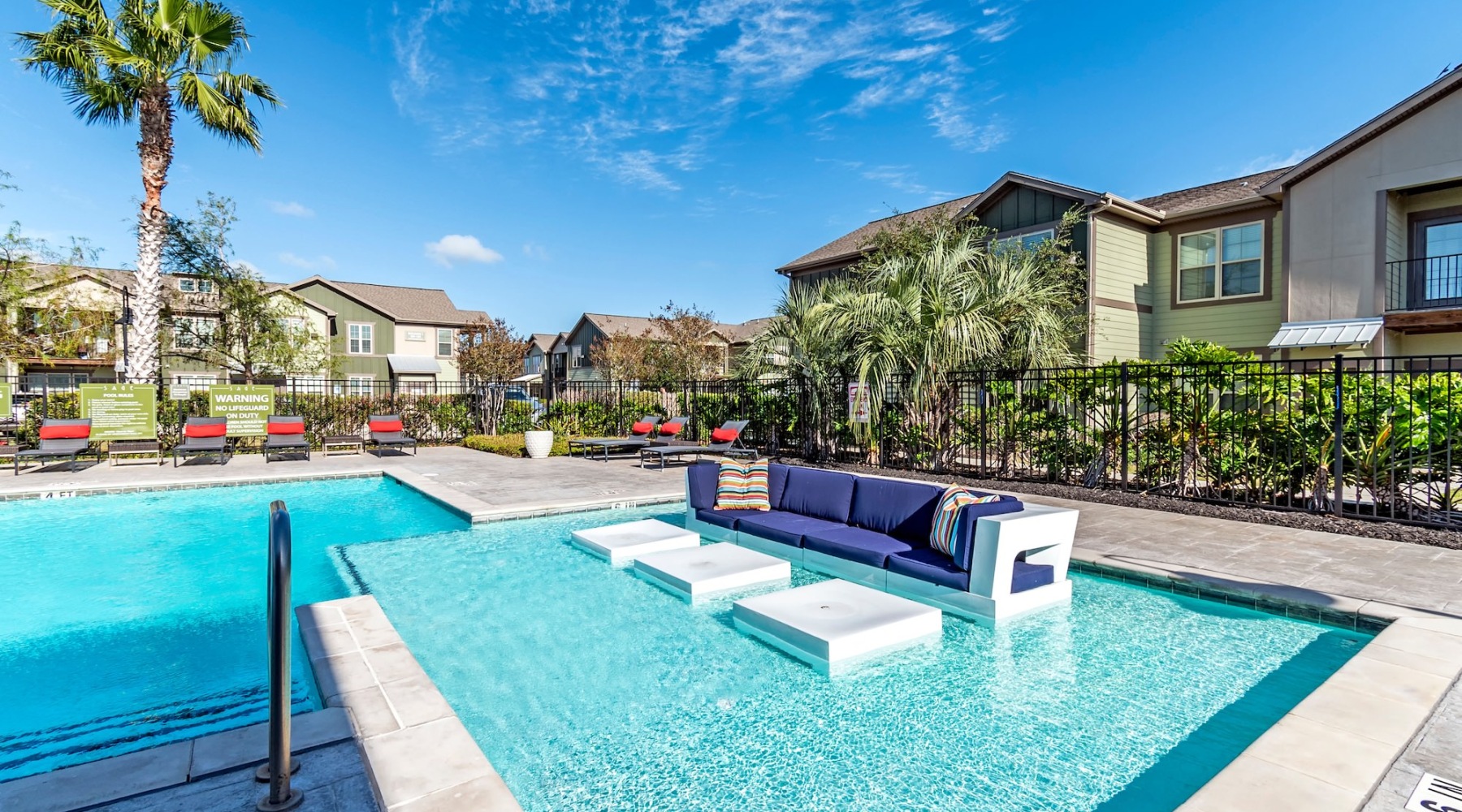 a swimming pool with a lounge chair