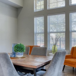 a dining room with a table and chairs