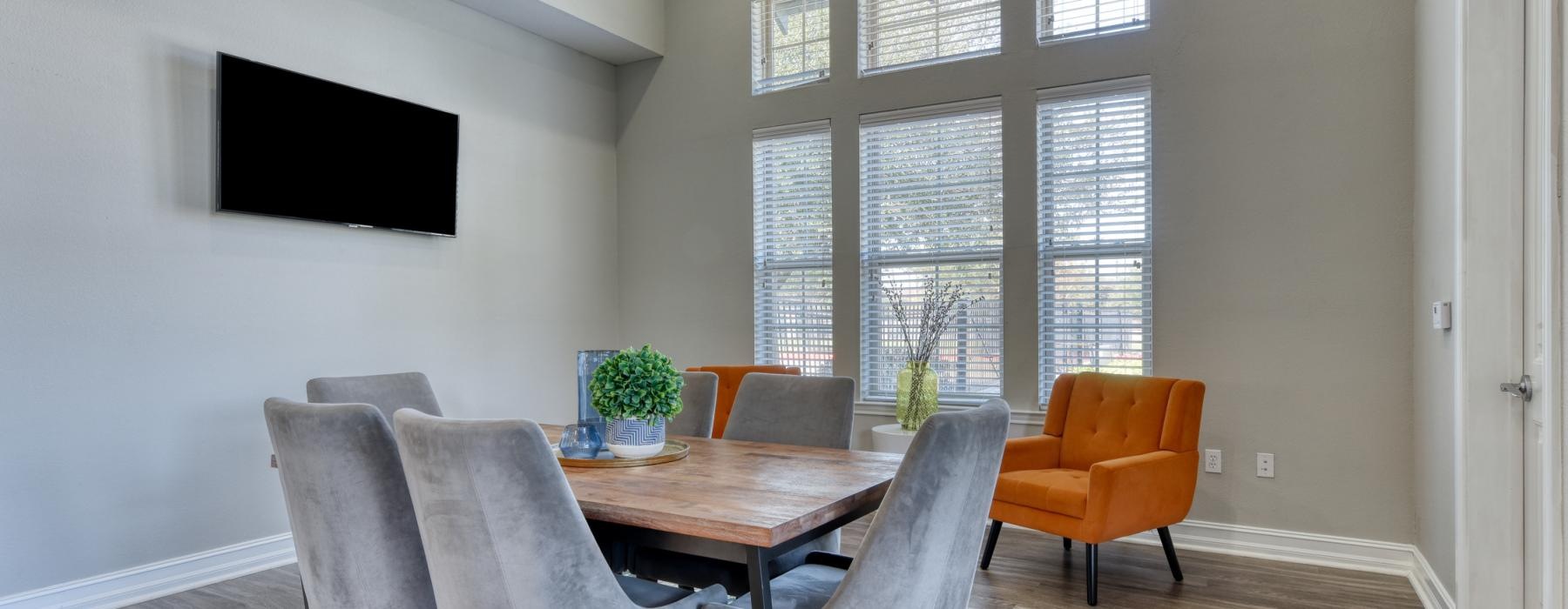 a dining room with a table and chairs