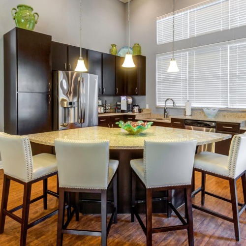 a kitchen with a table and chairs