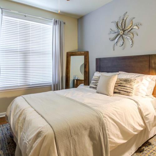 a bedroom with a fan