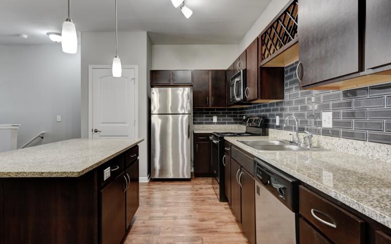 a kitchen with black appliances